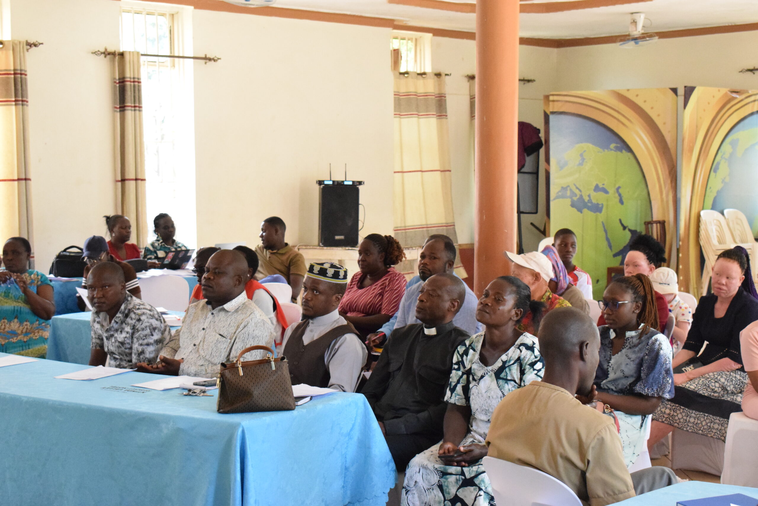 Participants listening to speeches during the WAA IAAD Celebrations 2026, reflecting on messages of inclusion, awareness, and equality for persons with albinism